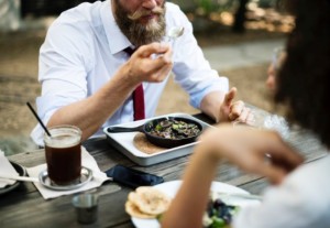 Two workers eating lunch in uniform