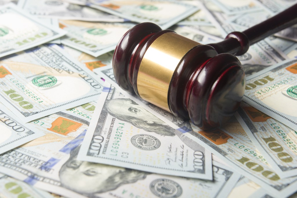 Gavel on a pile of US dollars.